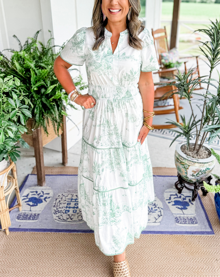 Close-up of the intricate classic toile print on a women's elegant maxi dress. Perfect for spring.