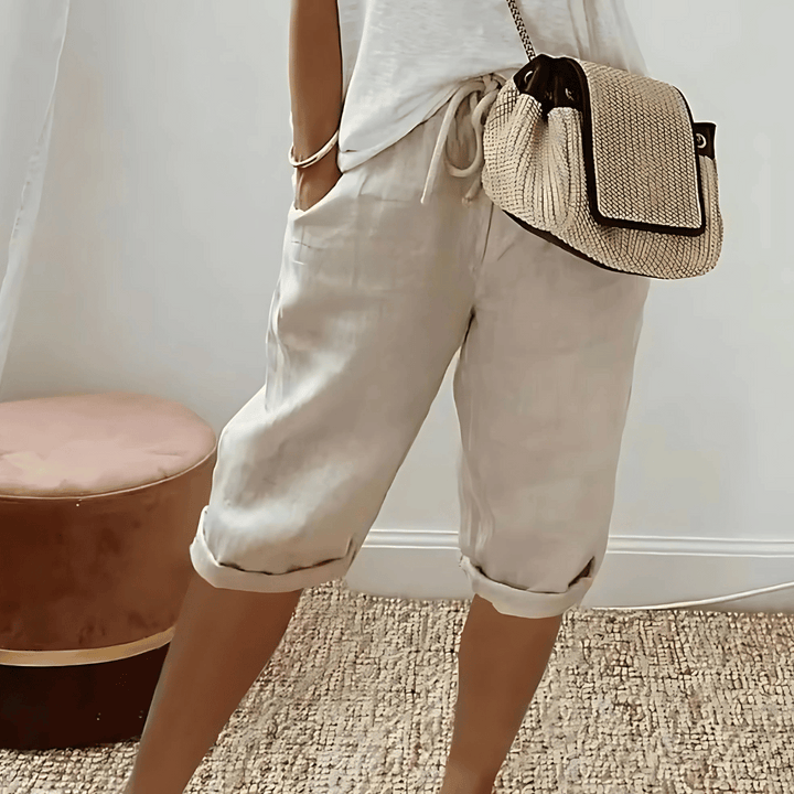 Versatile women's knee-length harem shorts with a relaxed fit, elastic waist, great for summer and vacation casual style.