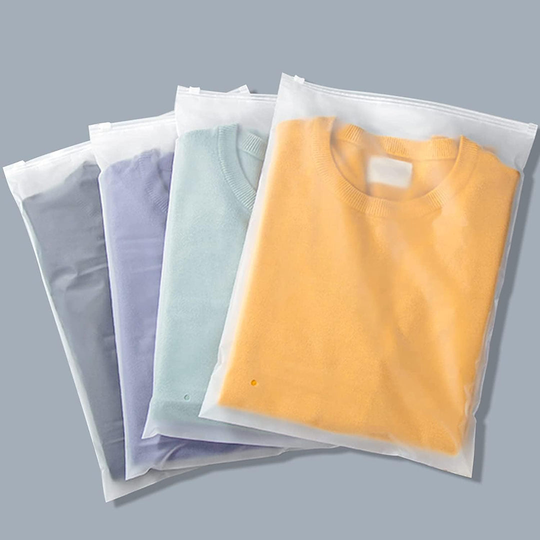 Stack of 20 frosted garment storage bags, highlighting their compact design for home organization.