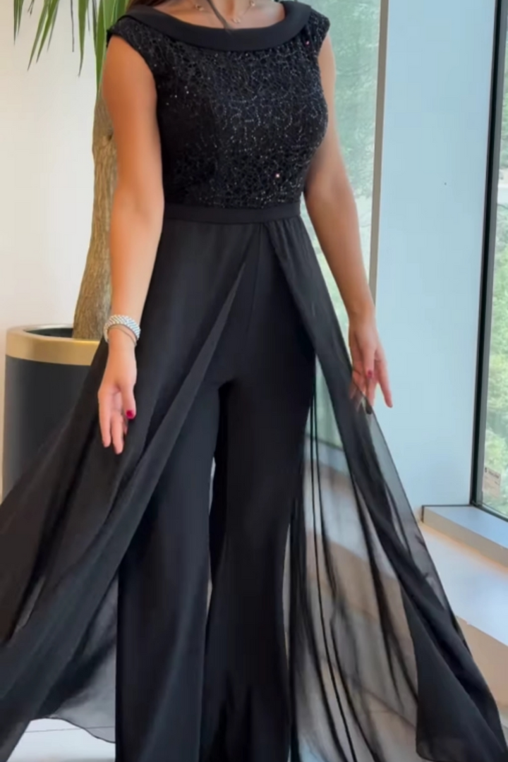 Stylish black textured women's jumpsuit, featuring a classic crew neck for elegant, comfortable one-piece fashion.
