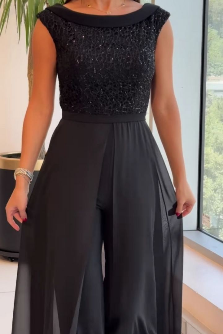 Versatile women's black textured jumpsuit, a chic one-piece with crew neck suitable for office, casual, or elegant fashion.