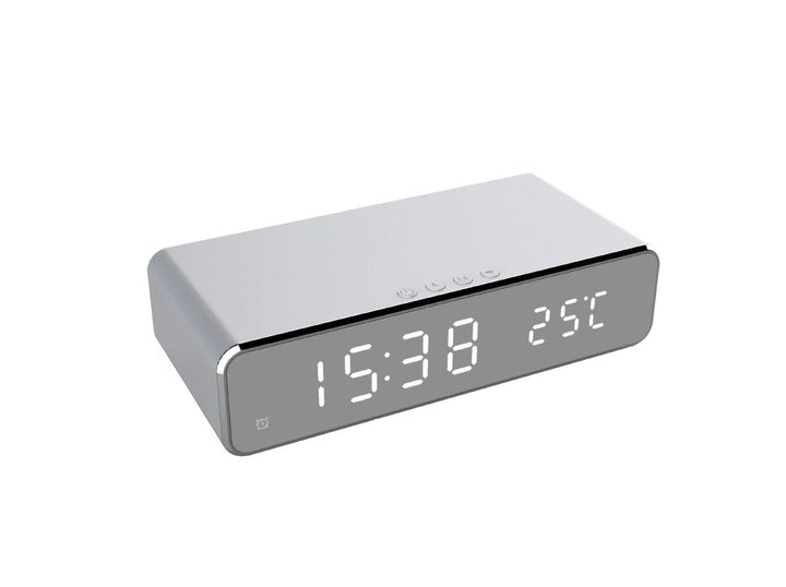 Versatile modern alarm clock featuring an LED display and integrated fast wireless phone charger.