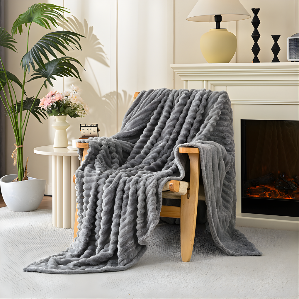 Ultra-soft faux fur throw blanket for cozy home comfort. Plush polyester throw adds luxurious feel to decor.
