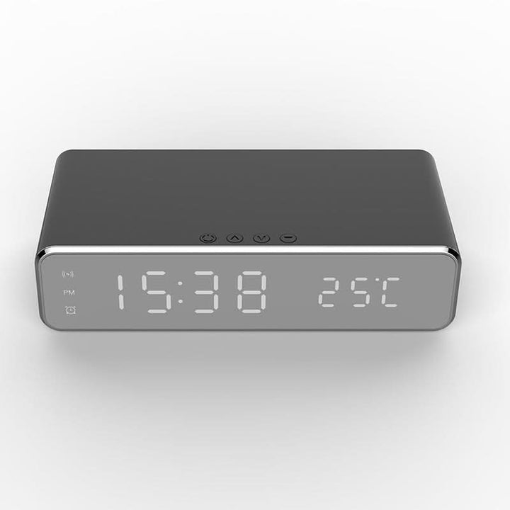 Compact modern LED clock with clear digital display and fast wireless charging functionality.