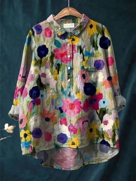 Side profile of model in an elegant floral women's blouse. Chic long sleeve top for spring fashion.