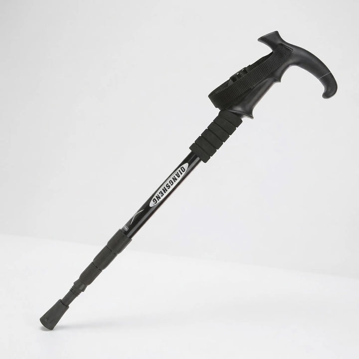 Modern black foldable hiking pole. Telescopic design for easy height adjustment & portability. Ideal trail support.