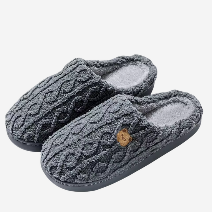 Fluffy women's plush slippers, designed for supreme warmth, comfort, and easy slip-on convenience at home.
