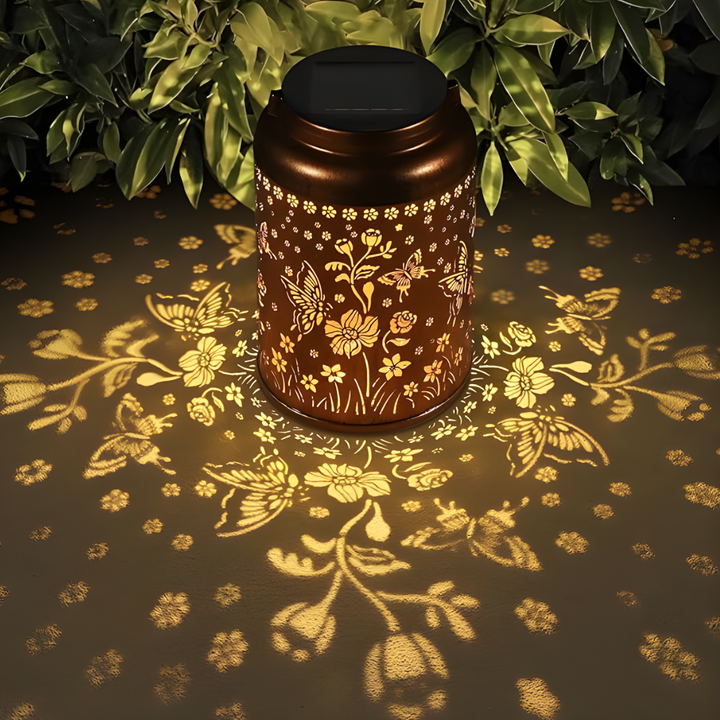 Nature-themed solar garden lantern, a charming accent for outdoor spaces and patios.