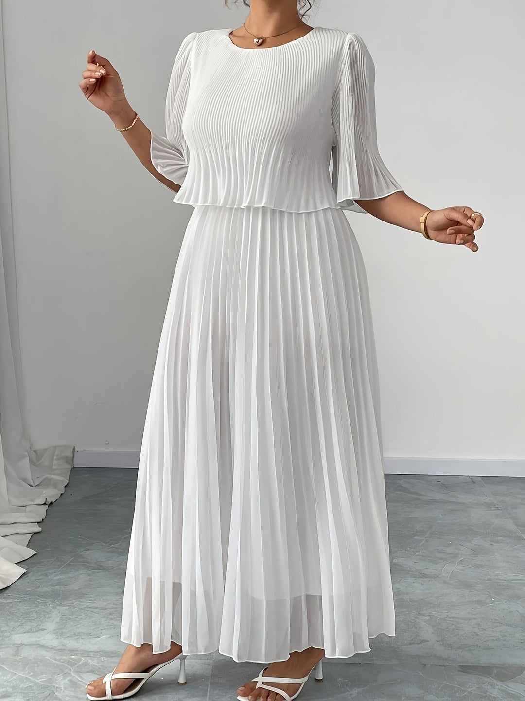 Stunning white A-line maxi dress with delicate pleats, a perfect elegant long formal evening gown for women.