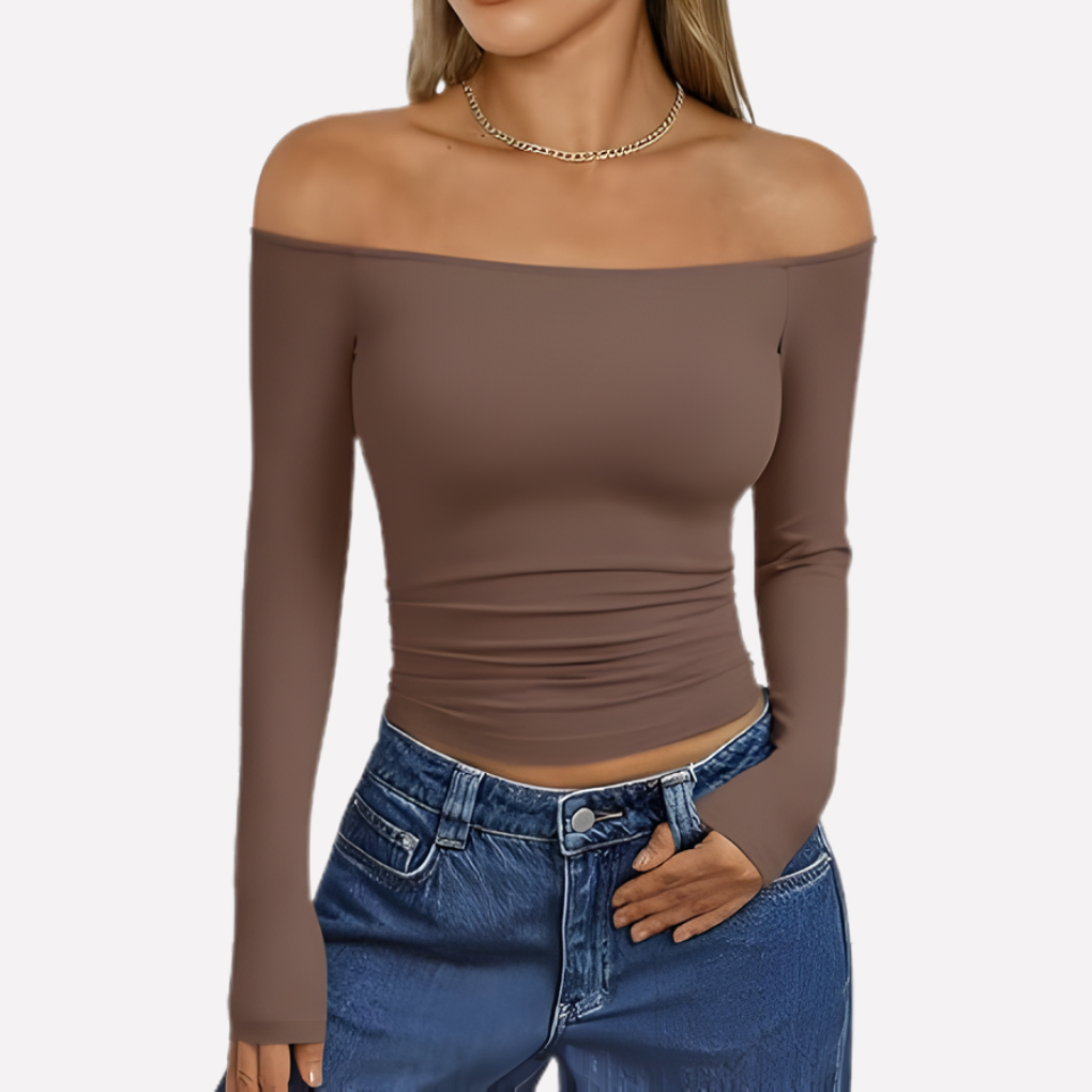 Fashionable off-shoulder long sleeve top for women; ideal for going out or stylish everyday wear.