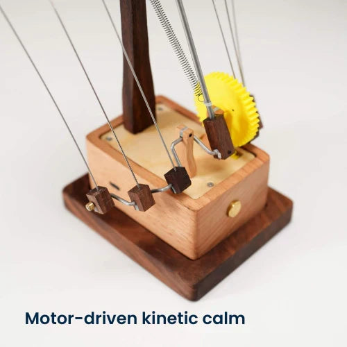 Elegant moving wood art: a hand-cranked kinetic manta ray sculpture, ocean-themed decor for any desk or office.