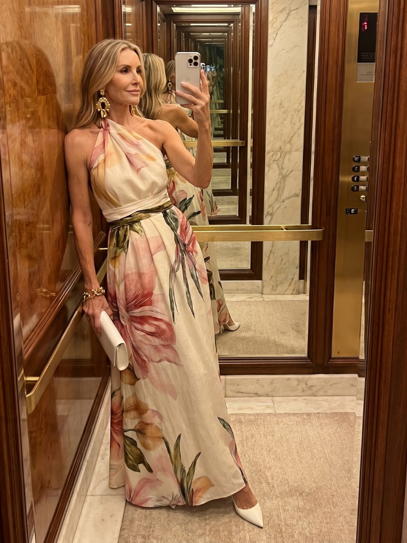Sleeveless women's halter maxi dress featuring a chic neckline and a voluminous, flowing skirt.