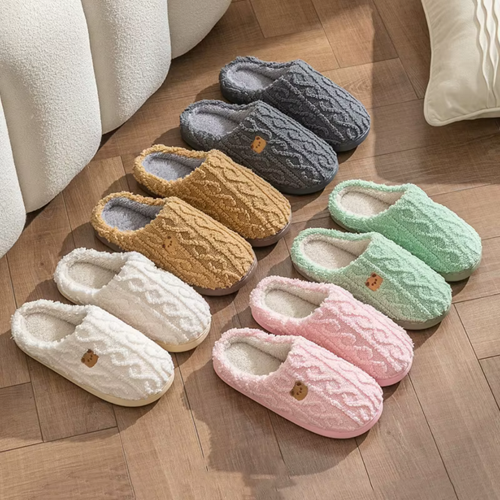 Soft women's indoor slippers, featuring a cozy plush design for year-round comfort & warm, happy feet.