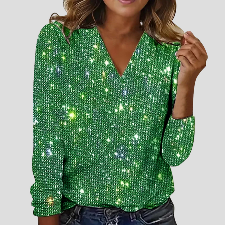 Festive women's glitter V-neck blouse with long sleeves. Elegant party top for holiday outfits and special occasions.
