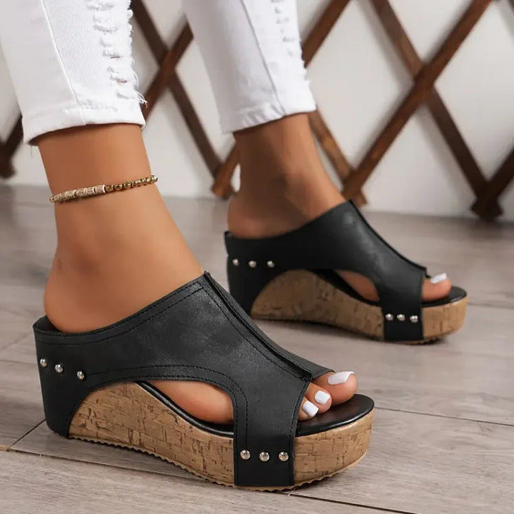 Women's orthopedic wedge sandals for comfortable walking, featuring an open-toe design and foot support.