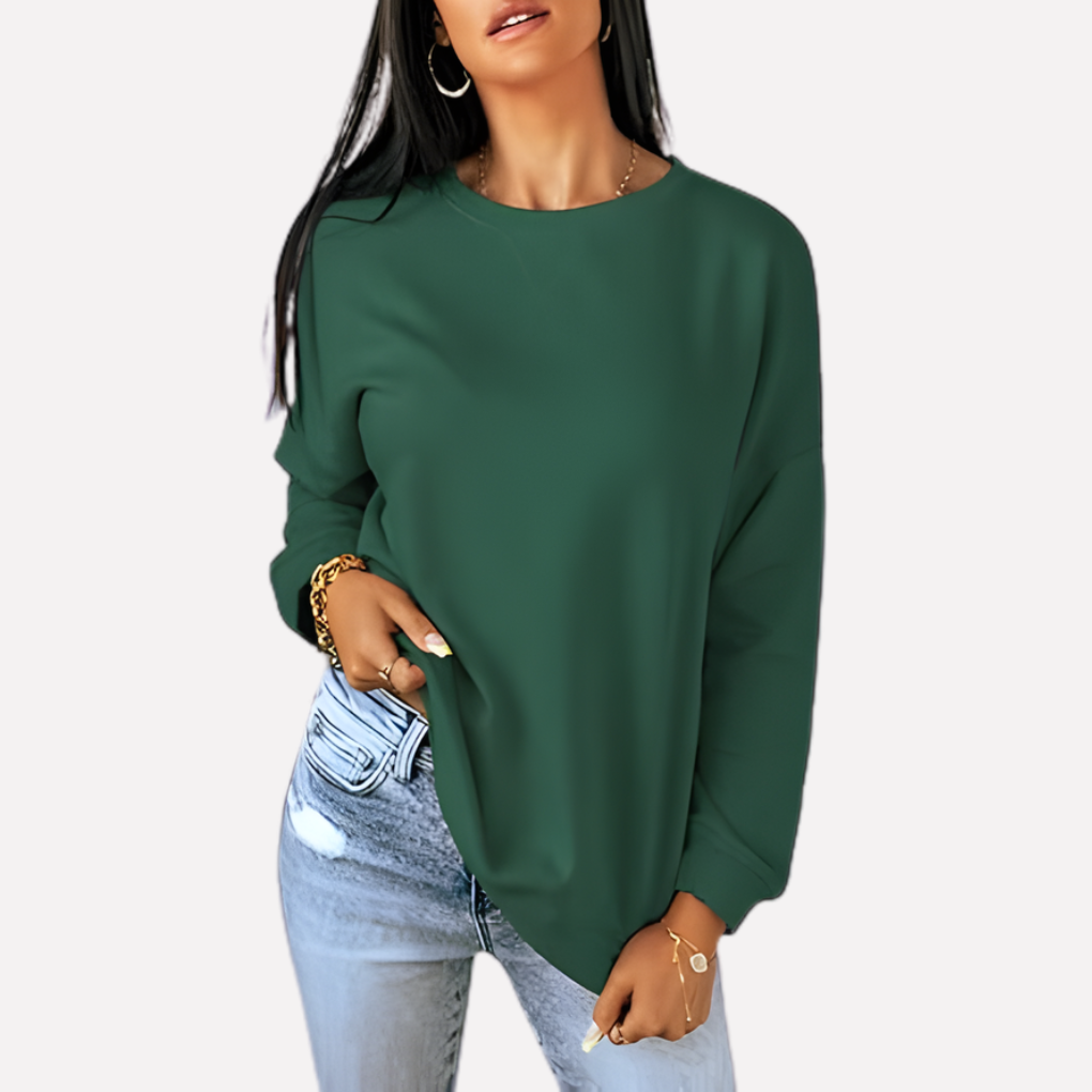 Soft women's relaxed fit crew neck sweatshirt, versatile for casual wear & layering.