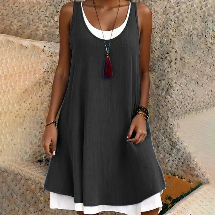 Women's layered mini dress with a sleeveless scoop neck and swing style, perfect for casual summer fashion.