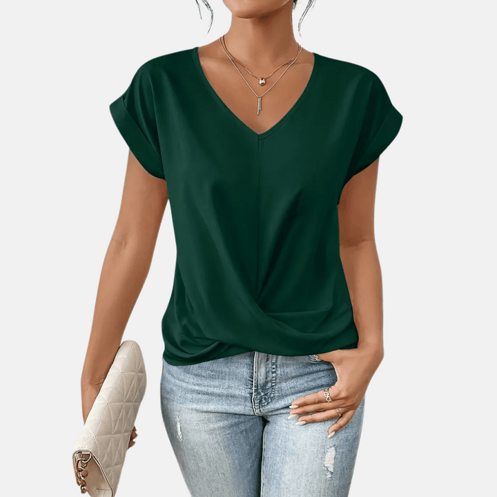 Relaxed fit women's V-neck blouse with short sleeves & a trendy draped hem for comfortable, everyday style.