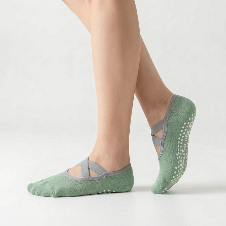 Green women's activewear grip socks, designed for studio fitness like yoga, ballet, and barre, with non-slip sole.