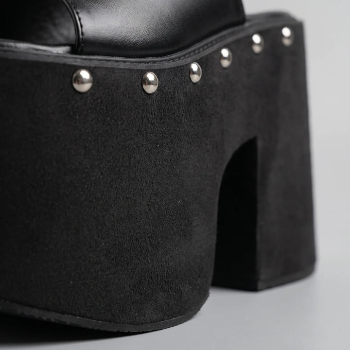 Slip-on black platform sandals for women, featuring a comfortable chunky block heel and versatile open-toe design.