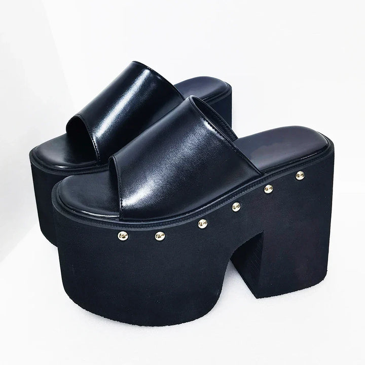 Chic women's black platform sandals, boasting a bold block heel and chunky sole, ideal for versatile summer styling.