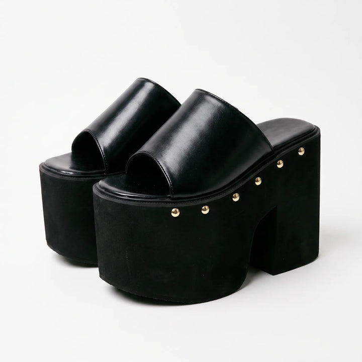 Modern women's black platform sandals with a sturdy block heel, chunky sole, and open toe for elegant summer looks.