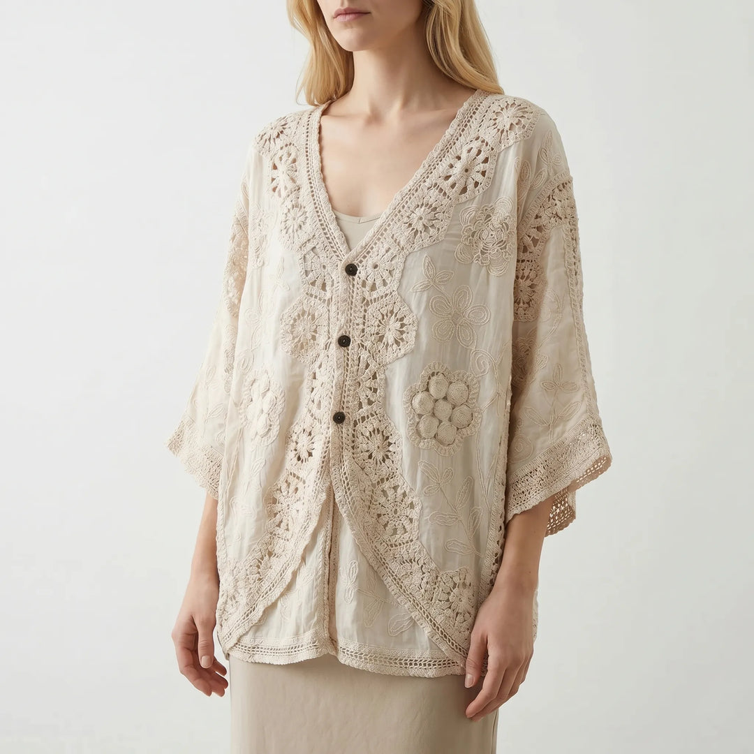 Textured crochet women's cardigan, sheer and loose fit, offering a relaxed bohemian style for summer.