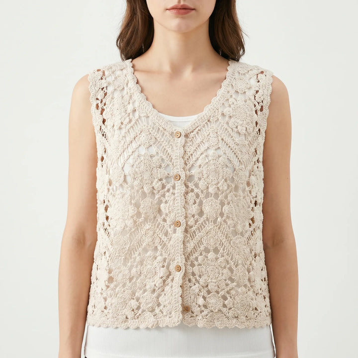 Sleeveless beige women's boho summer top, v-neck, button front. Great for relaxed vacation style or festival outfits.