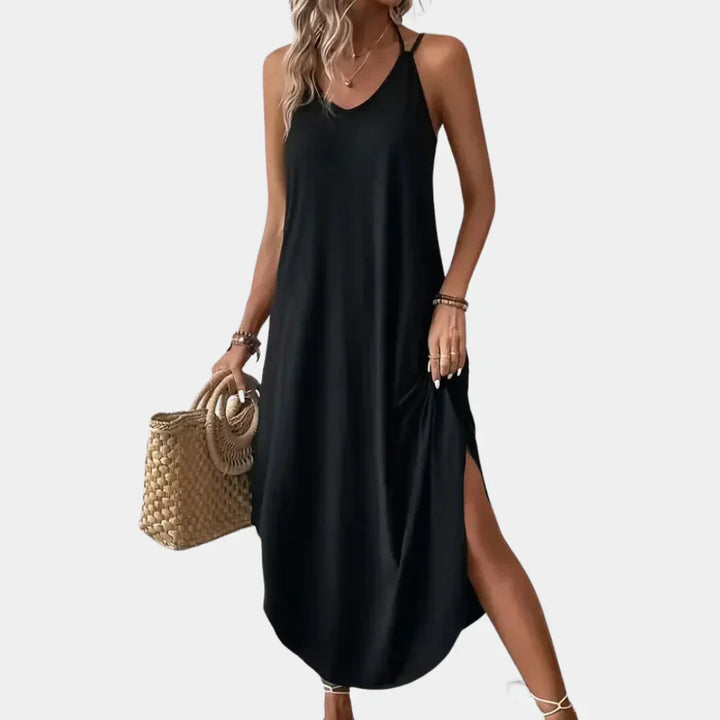Versatile women's black V-neck cami dress, a flowy summer style for elegant casual outings or evening parties.