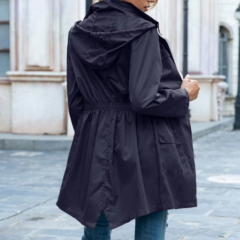 Modern women's zip-up trench coat, a sophisticated and lightweight long jacket, perfect transitional outerwear.