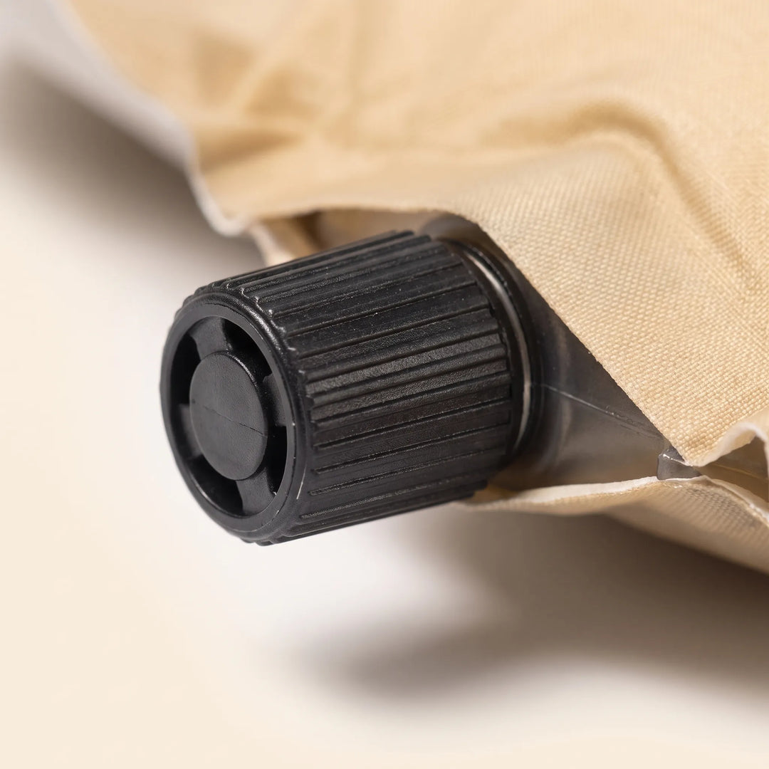 Comfortable unisex self-inflating sleeping pad with pillow for camping, hiking, and travel adventures.