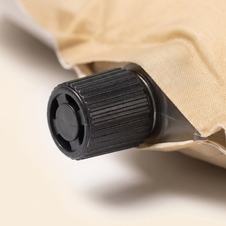 Comfortable unisex self-inflating sleeping pad with pillow for camping, hiking, and travel adventures.