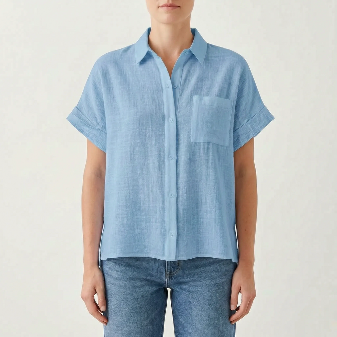 Loose fit women's short sleeve button-down blouse, a comfortable solid color top with chest pocket for casual wear.