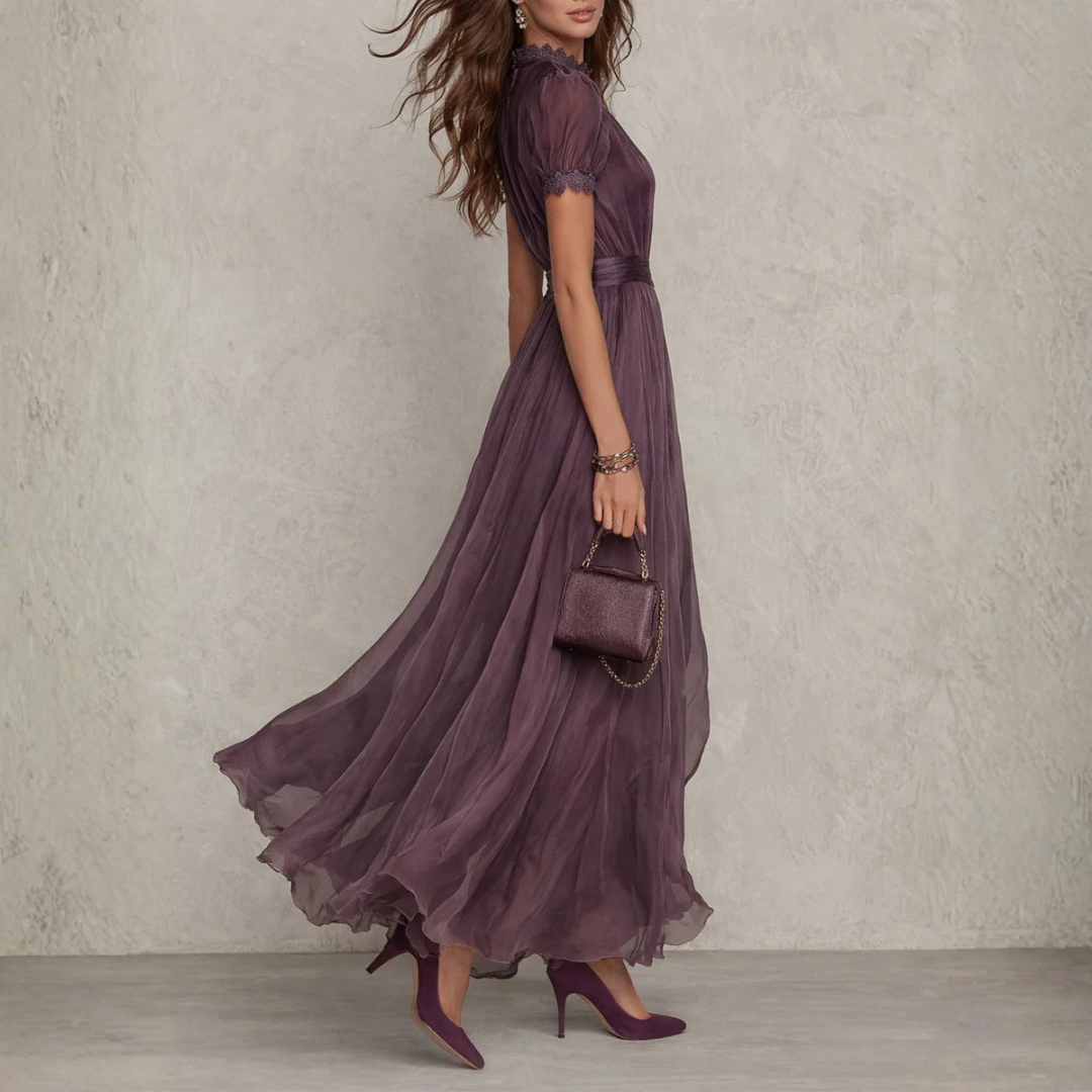 Romantic long purple maxi dress with intricate lace detailing, ideal for wedding guests & formal events.