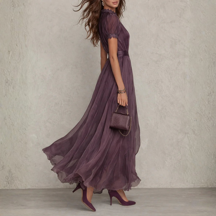 Romantic long purple maxi dress with intricate lace detailing, ideal for wedding guests & formal events.