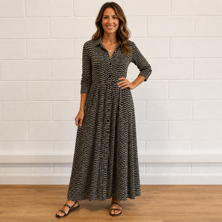 Women's printed button-front maxi dress with long sleeves. Elegant, flowy, and versatile for casual or vacation wear.