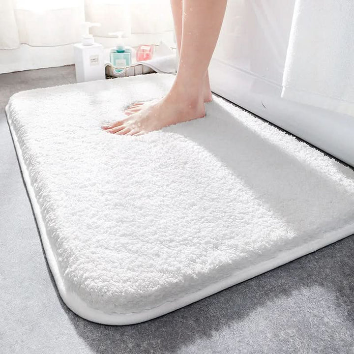Non-slip velvet bath mat, thick and quick-dry, perfect modern bathroom decor & floor comfort.