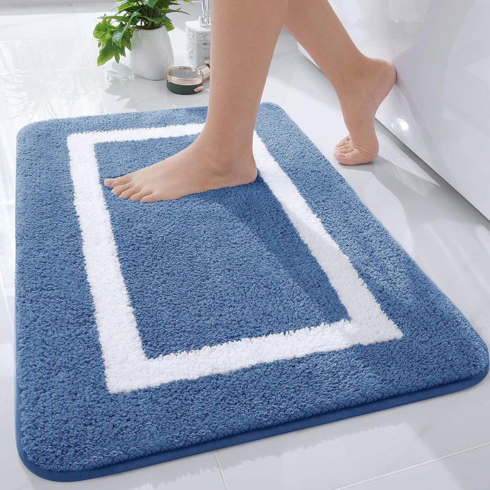 Non-slip bath mat, plush microfiber for safety & comfort. Quick-dry, washable bathroom rug. Modern home decor.