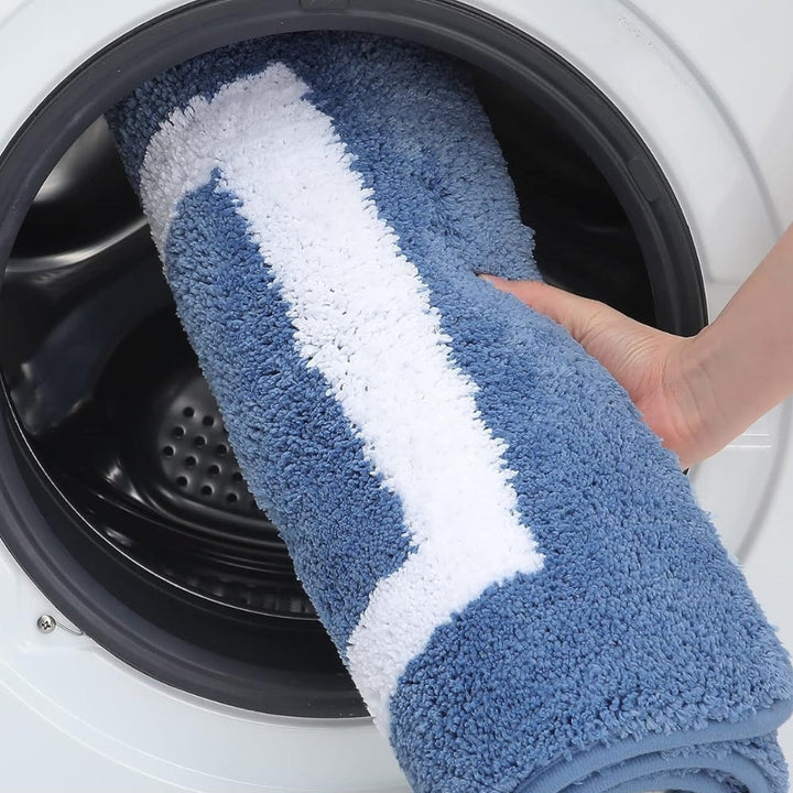 Soft, luxurious microfiber bath mat. Quick-dry & washable bath rug, perfect for modern bathroom decor. Non-slip design.