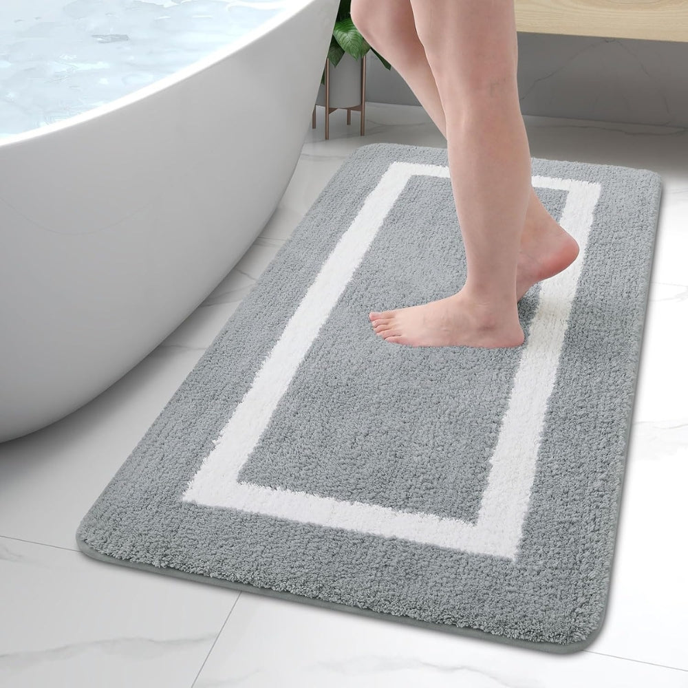 Modern design plush microfiber bath rug. Non-slip for safety, quick dry, & washable. Stylish bathroom decor mat.