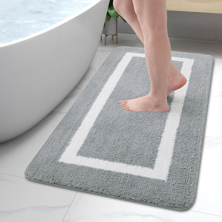 Modern design plush microfiber bath rug. Non-slip for safety, quick dry, & washable. Stylish bathroom decor mat.