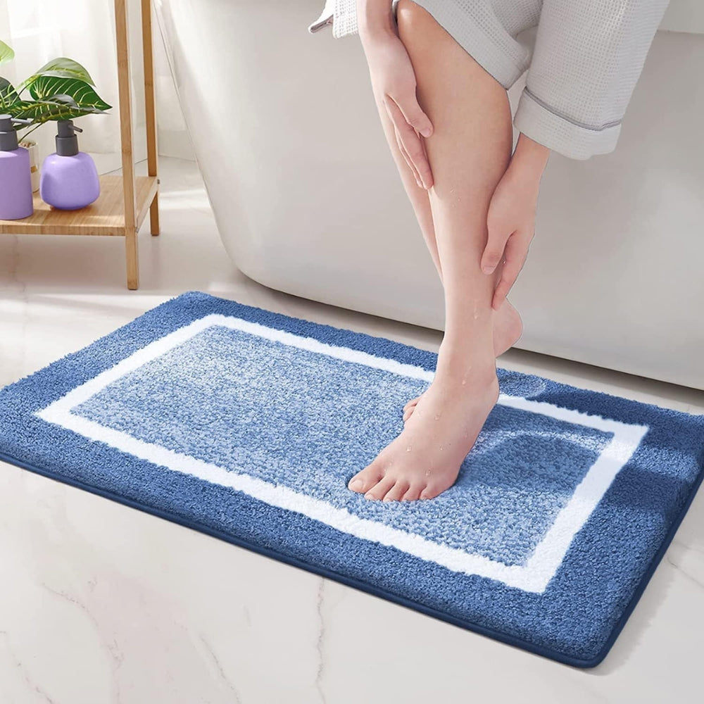 Washable & quick-dry microfiber bath mat. Plush, soft, and non-slip bath rug for home safety & comfort. Modern decor.