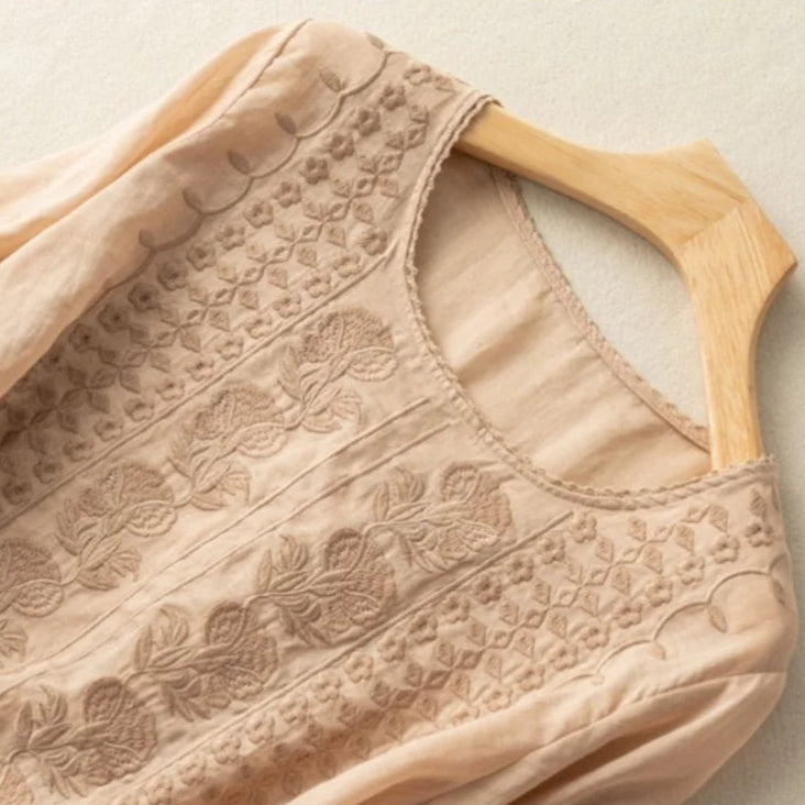 Feminine embroidered sheer puff sleeve top for women. Vintage style blouse, elegant casual fashion.