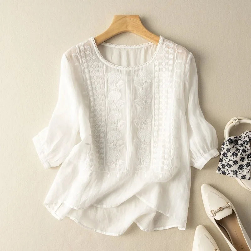 Sheer puff sleeve women's blouse with beautiful embroidery. Elegant three-quarter sleeve top, romantic style.