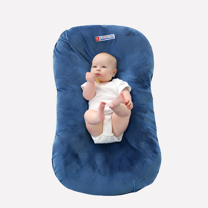 Ergonomic infant support pillow for optimal head and neck alignment. Ensures comfortable sleep for babies, portable design.
