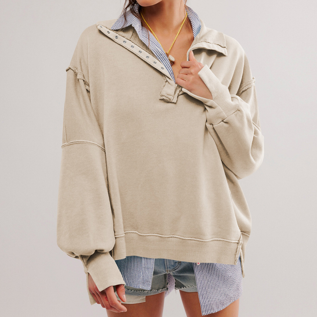 Woman wearing a relaxed fit oversized pullover, showcasing effortless comfort and versatile everyday style.