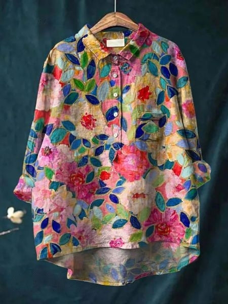 Chic women's floral print blouse with elegant long sleeves. Ideal for summer and spring fashion.