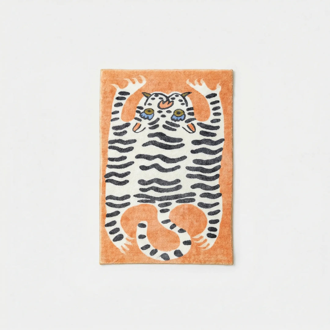 Colorful low pile area rug, animal print with wavy design, a fun addition to any kids' bedroom.