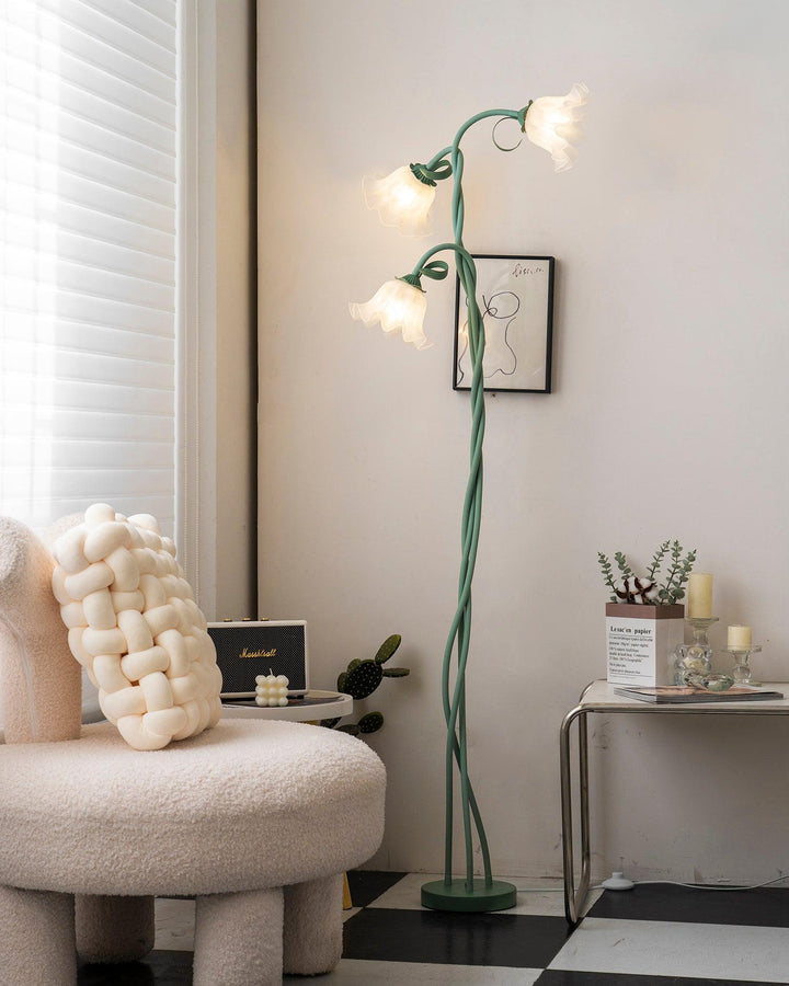 Decorative green floral floor lamp, provides warm ambient light for any modern room.