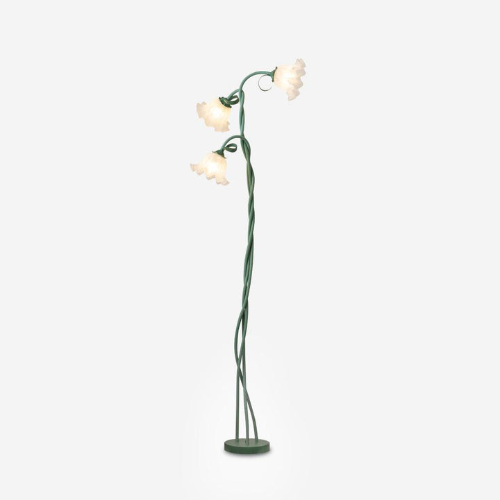 Elegant green floral lamp, floor standing, modern design, white shade for ambient glow.